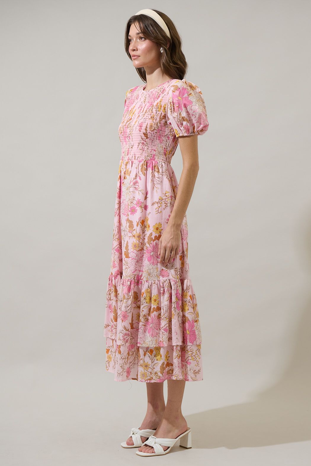 Pink floral cotton midi dress with puff sleeves and tiered hem side view