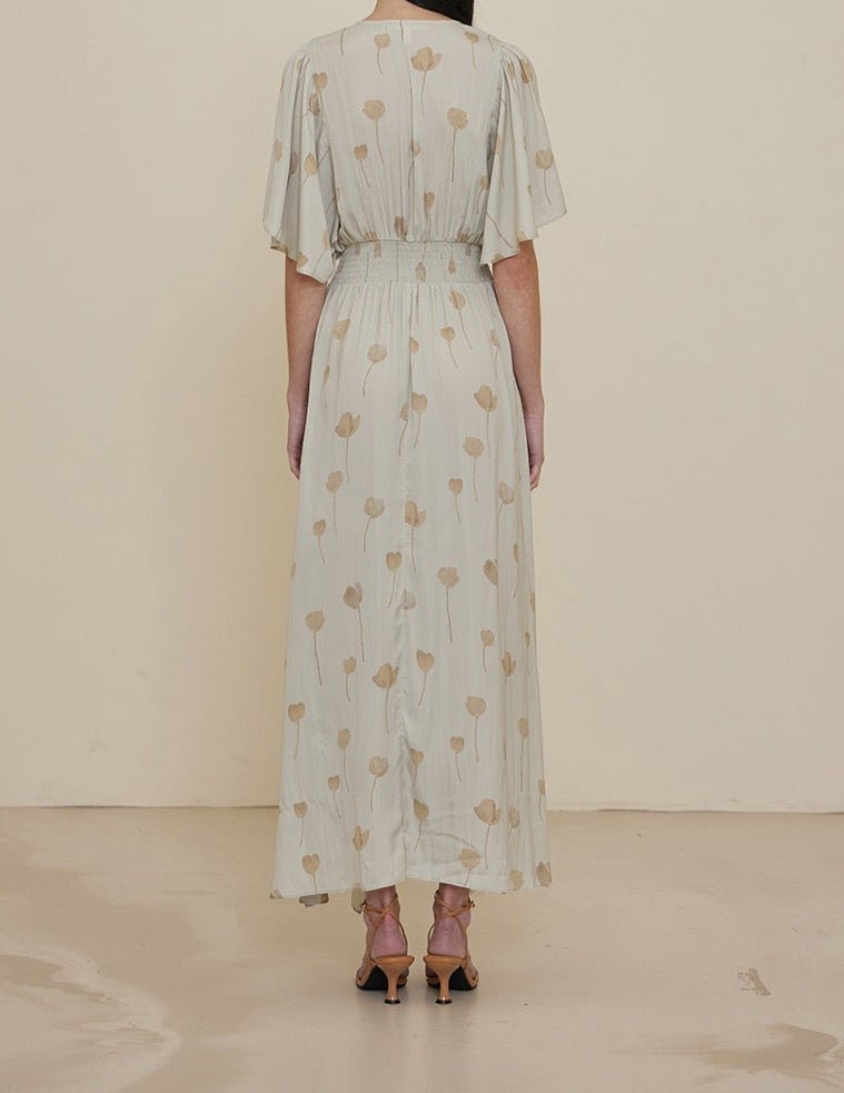 Back view of soft blue watercolor maxi dress