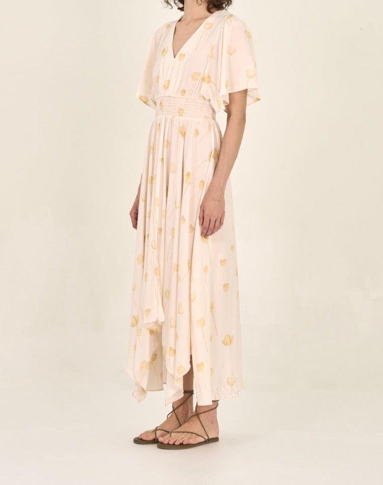Side view of watercolor floral maxi dress with flutter sleeves