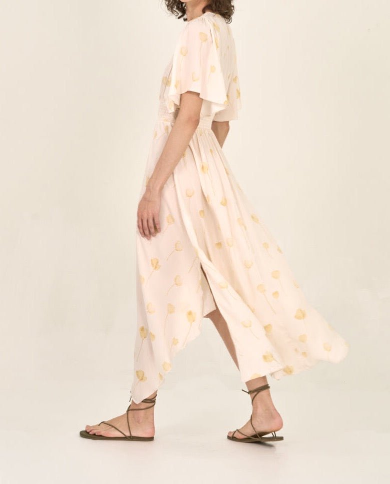 Side view of watercolor floral maxi dress with flutter sleeves