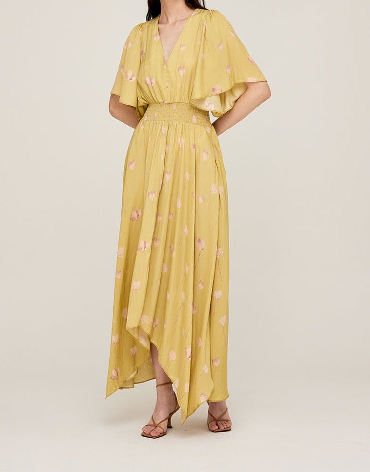 Front angled view of butter yellow maxi dress with elastic waist