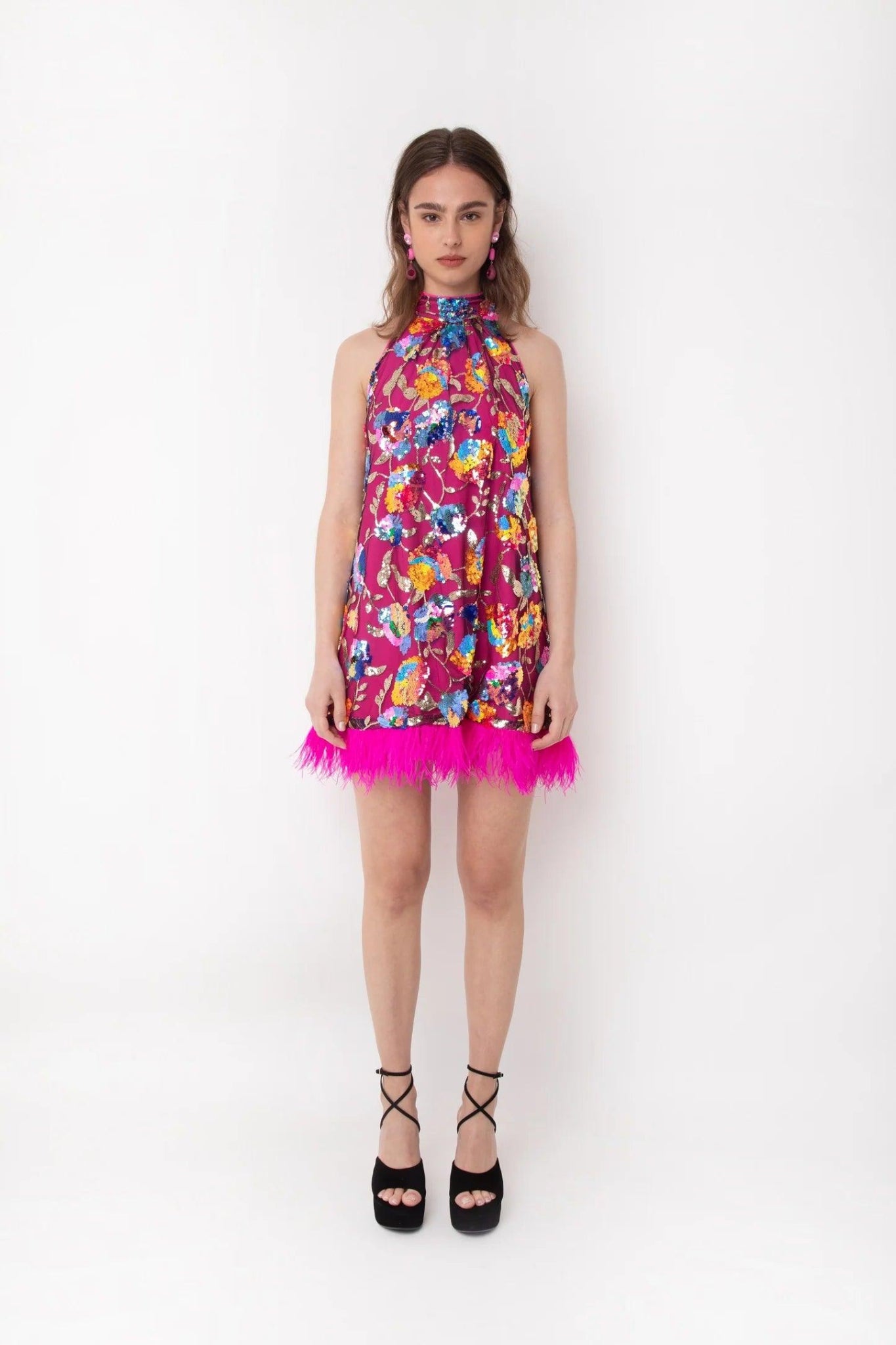 Side view of pink floral sequin feather trim mini dress with sleeveless high-neck silhouette