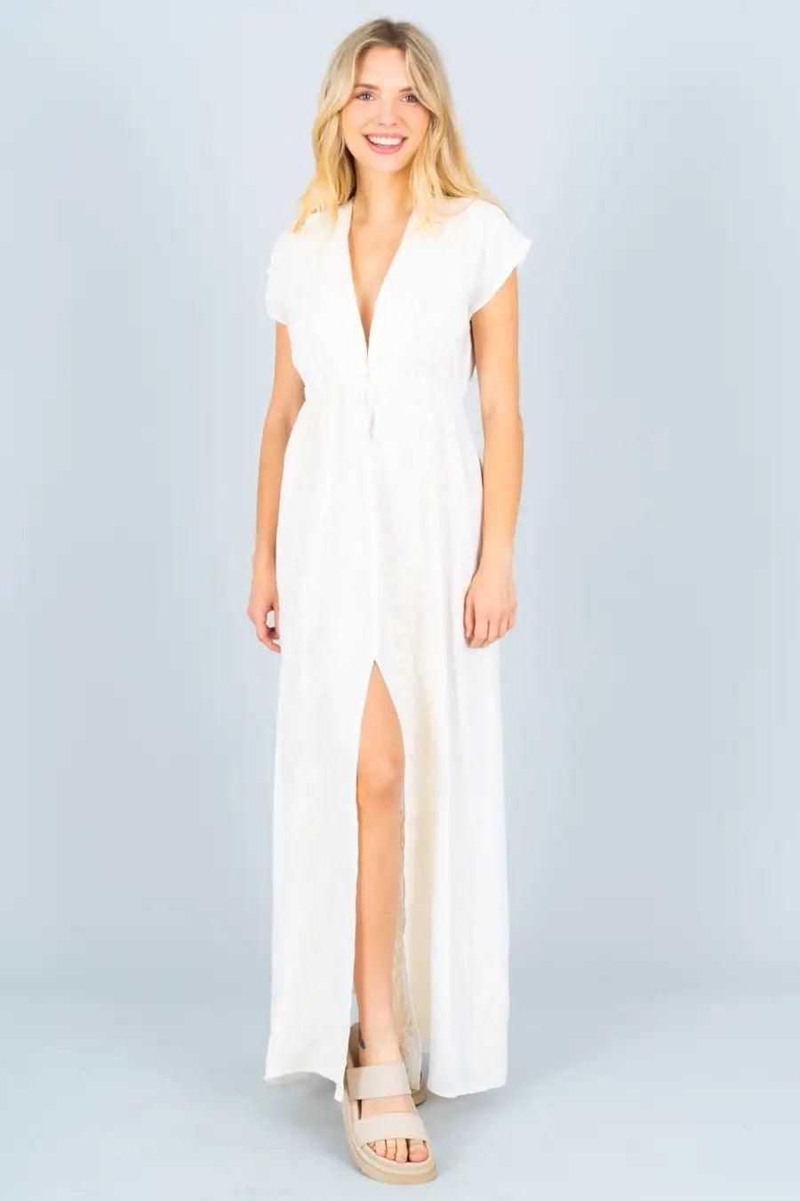 Model wearing Renee C white embroidered cotton maxi dress with front split