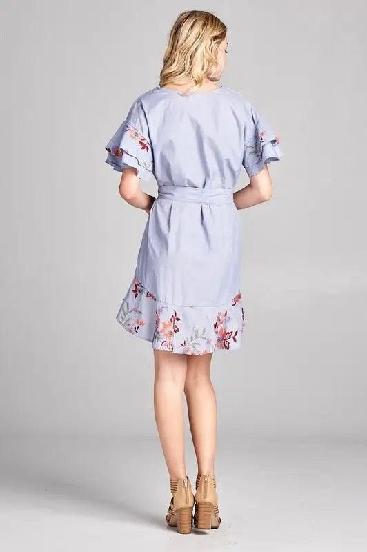 Light blue cotton tie-waist dress with floral embroidery and flared hem