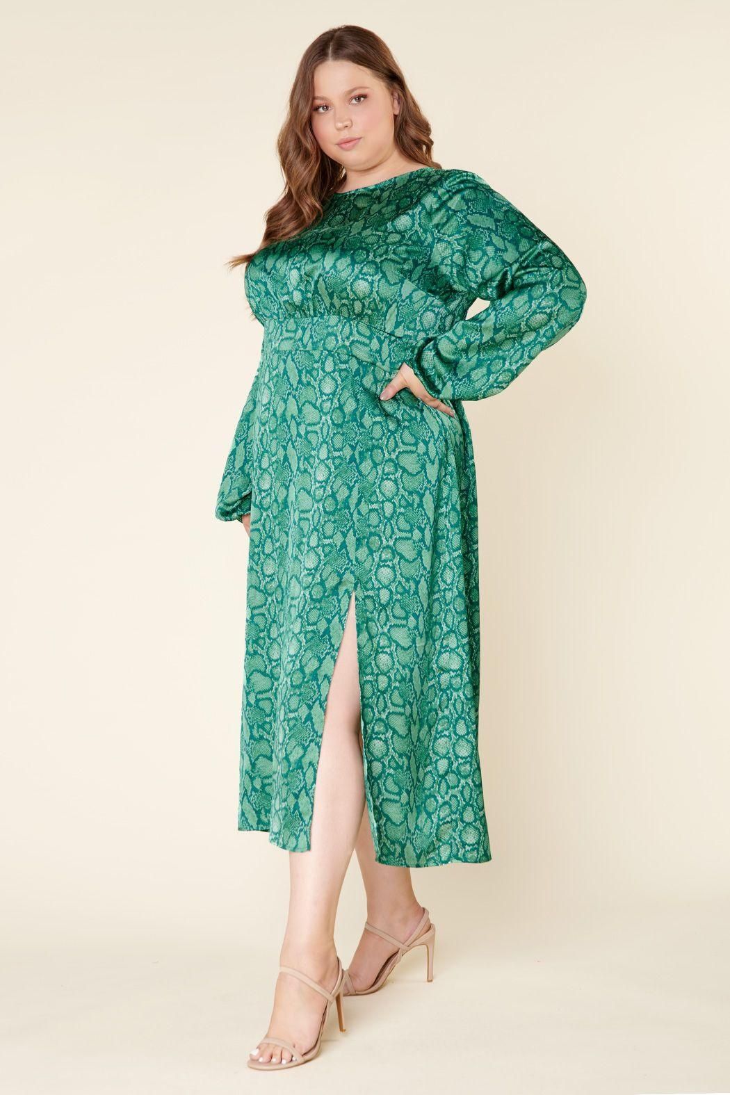 Side view of plus size green print midi dress with slim silhouette and front slit
