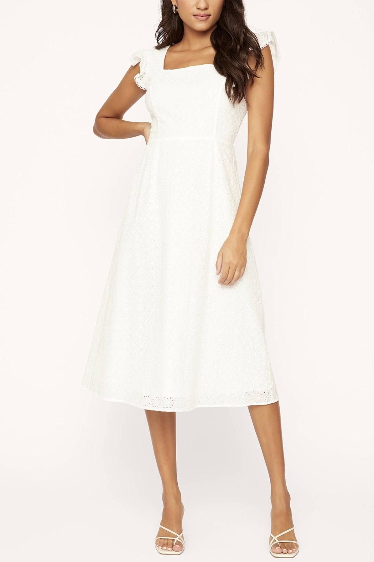 Lost + Wander white midi dress showing clean sleeveless shape and easy summer styling