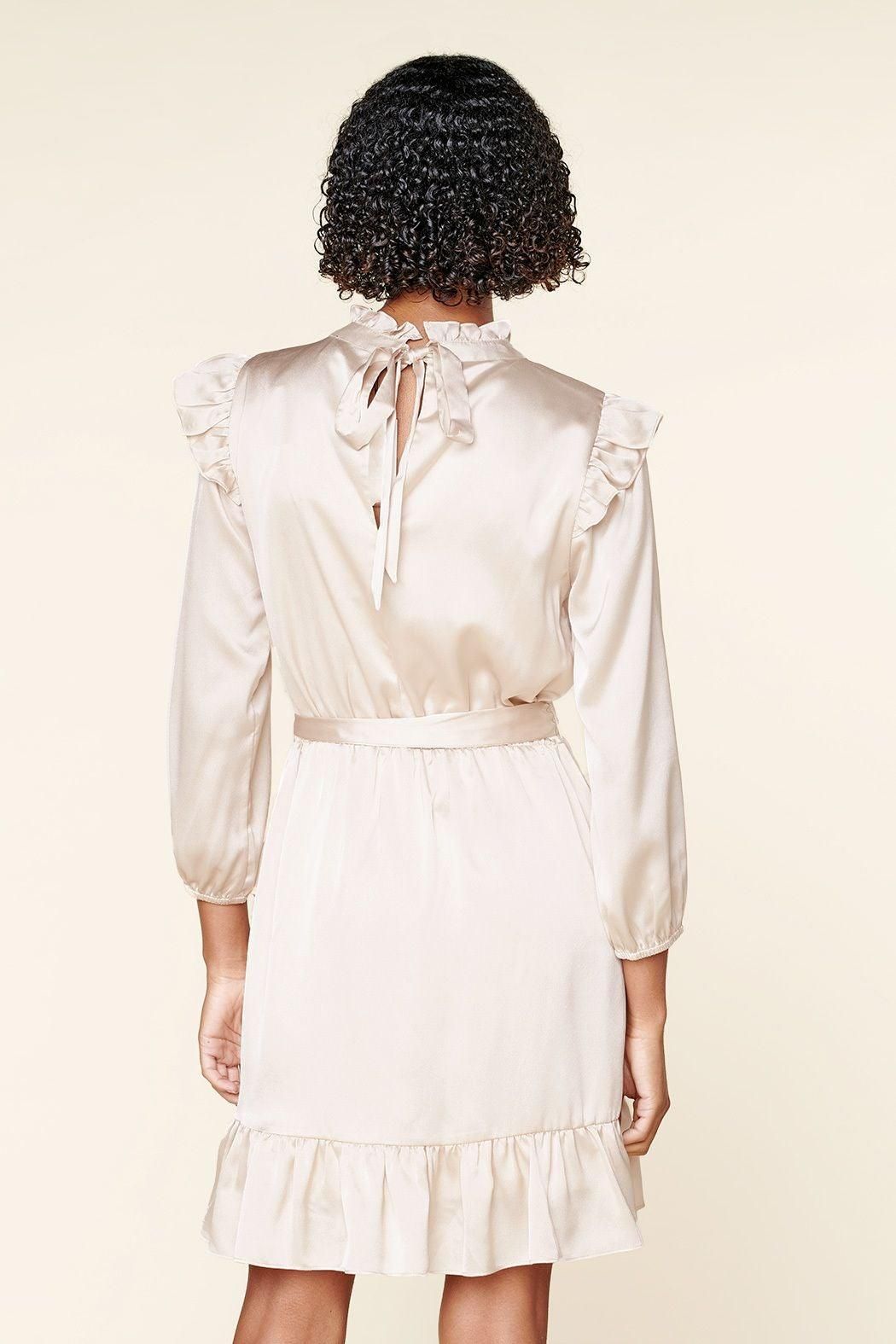 Back view of champagne satin mini dress with long sleeves