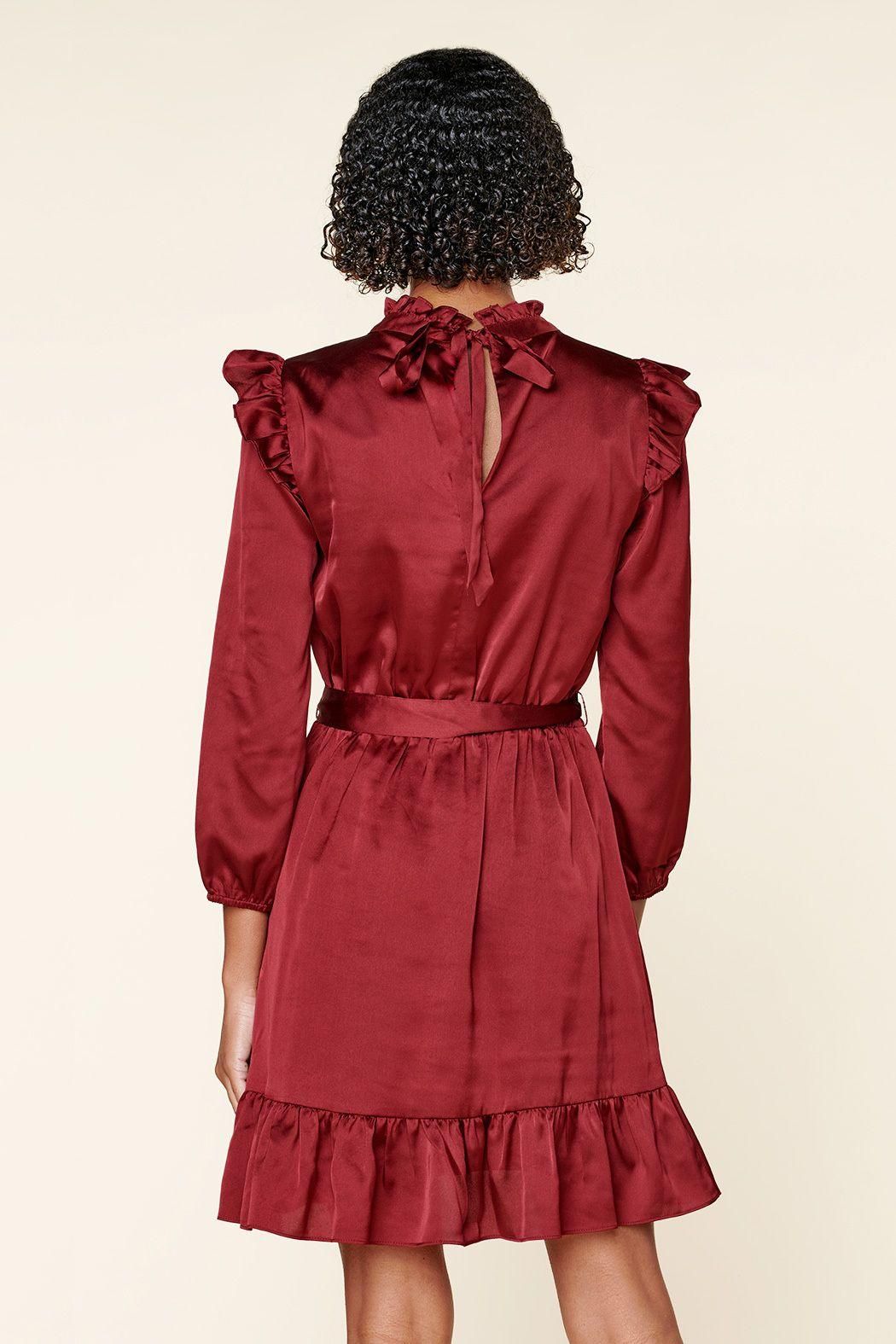 Back view of burgundy mini dress with long sleeves and flared hem