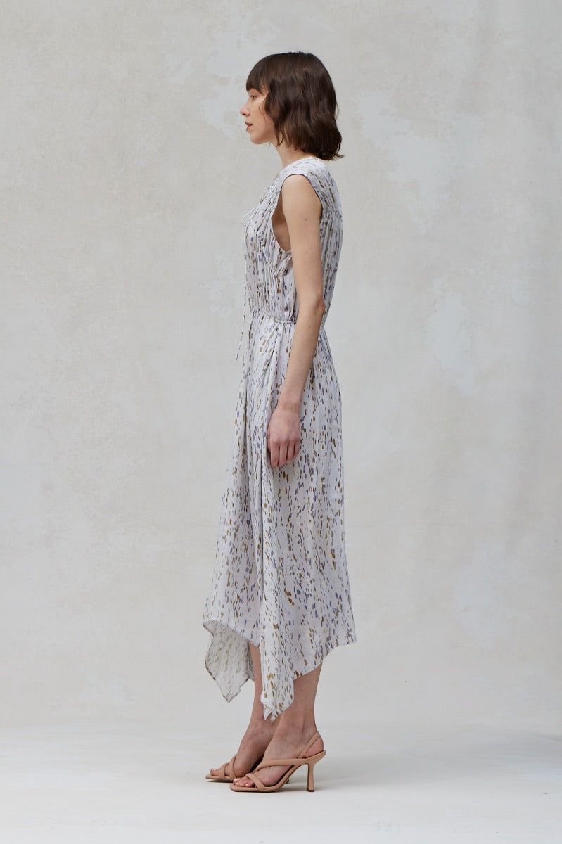Side view of Blue Dusk sleeveless print midi dress with elastic waist and asymmetrical handkerchief hem