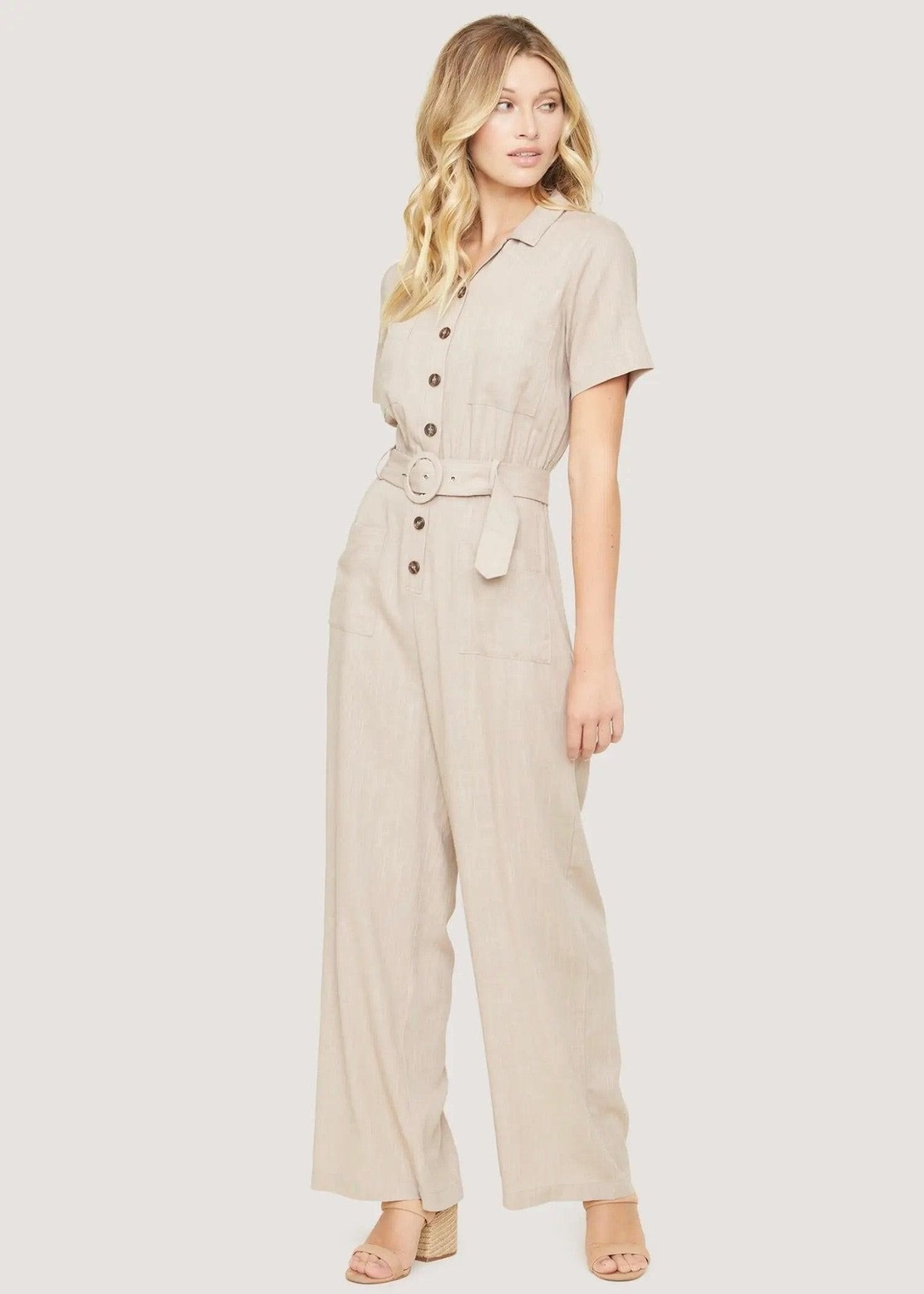 Back view of Lost + Wander Weekend Bliss almond jumpsuit with relaxed wide-leg shape