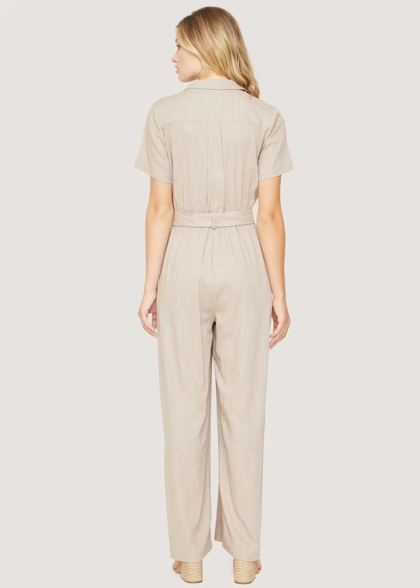 Back view of Lost + Wander Weekend Bliss almond jumpsuit with relaxed wide-leg shape