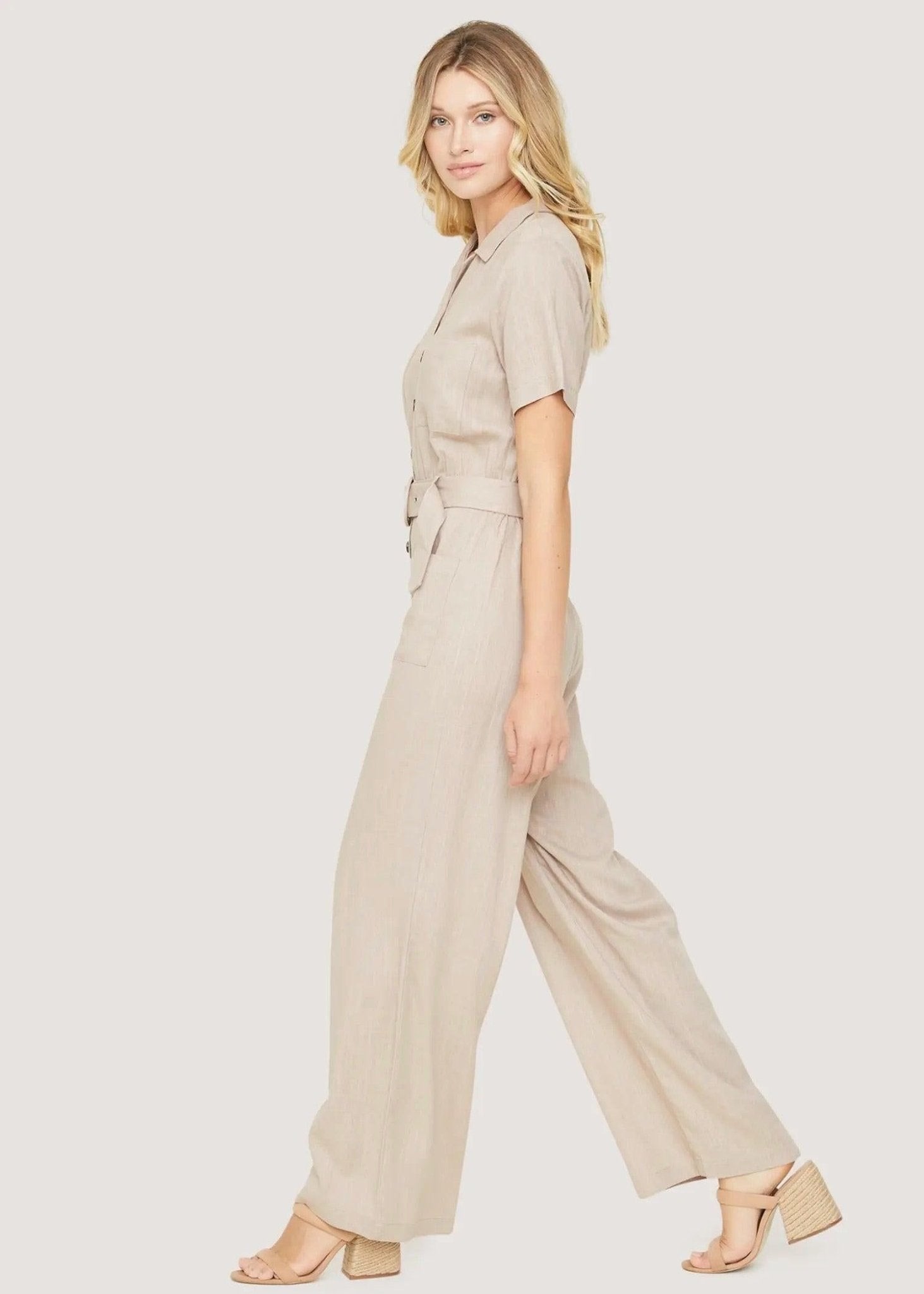 Lost + Wander almond wide-leg jumpsuit styled for brunch, travel, and weekend outings